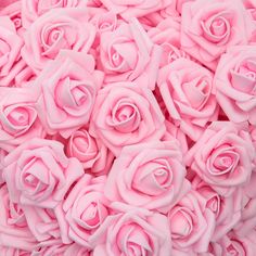 many pink roses are arranged together in the shape of heart shaped flowers, as well as petals