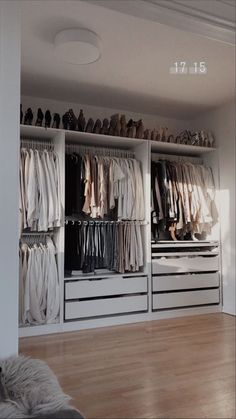 the closet is full of clothes and shoes