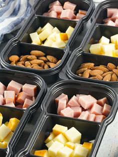 several trays filled with different types of food