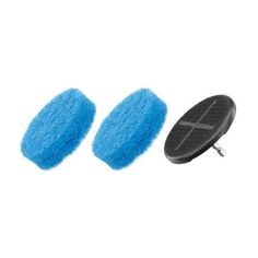 two blue sponges next to a black disc on a white background with a clipping in the middle