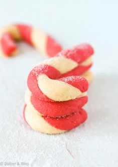 red and white cookies stacked on top of each other in the shape of a knot