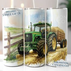 three beer cans with pictures of tractors and farm equipment painted on them, sitting next to each other