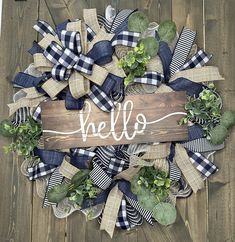 a wreath with the word hello painted on it