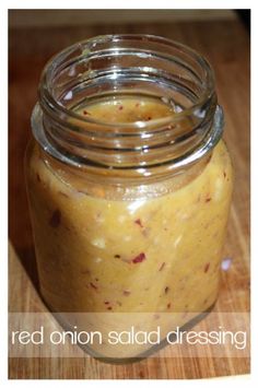 a jar filled with food sitting on top of a wooden table