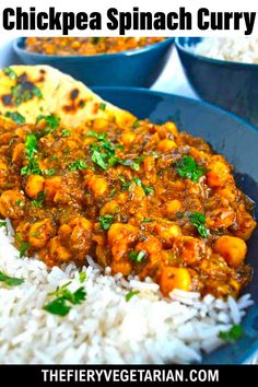 a blue plate topped with rice and chickpea curry