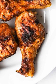 four pieces of chicken sitting on top of a table