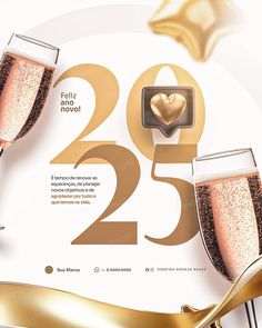 two glasses of champagne are next to a sign with the number twenty five in gold