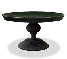 a round table with an iron base and black top