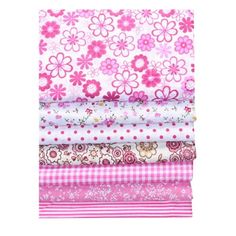 pink and white fabric with flowers on it, including one in the middle is shown