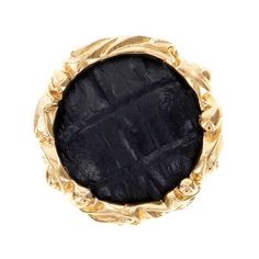 a gold ring with black stone in the center