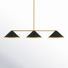 three lights hanging from the ceiling in a room with white walls and black flooring