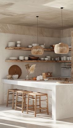 the kitchen is clean and ready to be used for cooking or baking, with wooden stools at the counter