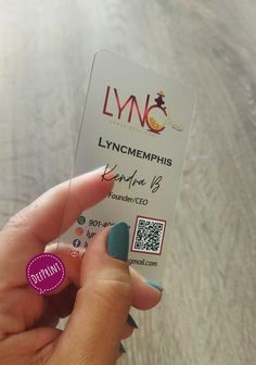 a person holding up a business card with q - tip nails on their fingers and the name lync memphiss