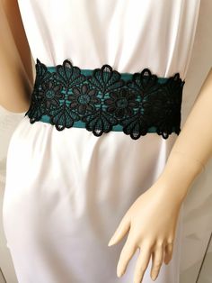 If you would like this belt in a different length or width, please, write to us. The Green (emerald) wide satin belt with lace. This extra long sash is 3 inches wide and 100 inches long. The length of the lace on the belt is 20 inches. Belt material: stretch satin, lace. The satin belt is available in the following colors: 1 White 2 Ivory 3 Champagne 4 Beige 5 Peach 6 Light pink 7 Pink 8 Lilac 9 Dark pink 10 Red 11 Burgundy 12 Terracotta 13 Gray 14 Dark brown 15 Black  16 Dark green 17 Sky blue 18 Royal blue 19 Navy blue  20 Aqua blue Elegant Fitted Corset Belt With Lace Trim, Elegant Lace Wedding Corset Belt, Elegant Wedding Lace Corset Belt, Elegant Lace Corset Belt, Lace Corset Belt For Wedding, Lace Wedding Corset Belt, Black Sash Belt For Party, Black Sashes Belt For Party, Elegant Fitted Corset Belt With Sashes