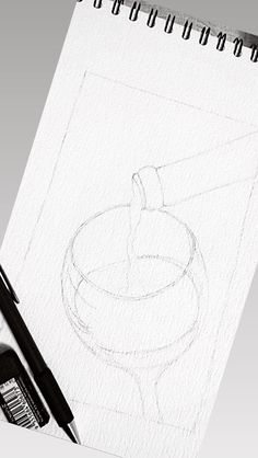 a drawing of a bowl with a spoon on it next to a marker and pen