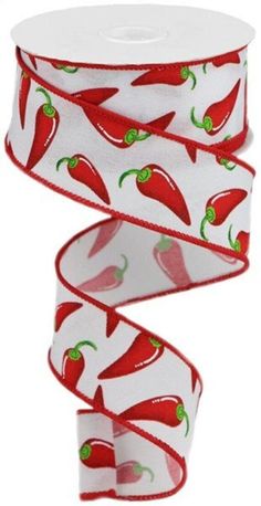 a roll of red chili peppers on white ribbon with green peppers printed on the side