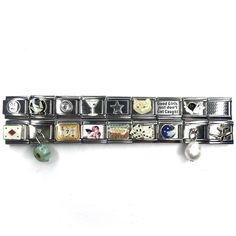 a metal bracelet with various charms on it