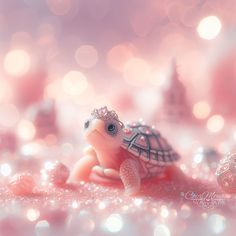 a small turtle with a tiara on it's head