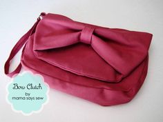 a pink purse with a bow on it