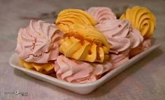 a white bowl filled with yellow and pink ice cream