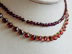 Emanating understated elegance, this gorgeous garnet piece glitters and glows in the sunlight. Each garnet briolette is handpicked for its flawless beauty and lovingly wire-wrapped on to its chain. We only source the highest quality garnet as we love the deep red hue of these precious gems. This beautiful necklace is part of a set with an accompanying bracelet and earrings as part of our garnet collection. 💜 G E M S T O N E S 💜 * Gemstone: Natural Pyrope Garnet. * Size: 6mm. * Cut: Hand-cut mi Pyrope Garnet, Pretty Accessories, Garnet Red, Garnet Pendant, Red Necklace, Garnet Jewelry, Red Gemstones, Beaded Choker, Drop Necklace