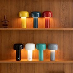 there are many different colored lights on the shelves