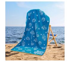 a beach chair covered in a blue towel