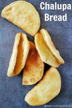 several pieces of bread sitting next to each other on a blue surface with the words chalupa bread