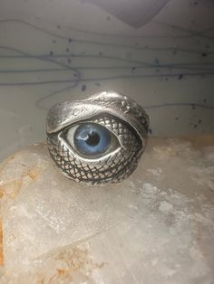 an eye ring sitting on top of a rock