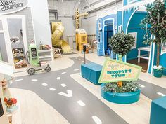 the children's playroom is decorated in blue and white colors with a sign that says, welcome to photy's town