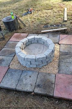 a fire pit sitting in the middle of a yard