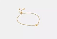 COACH® | Interlocking Slider Bracelet Capsule Wardrobe, Slider Bracelet, Gold Charm Bracelet, Coach Outlet, Christmas 2024, Gold Charm, Christmas List, Sliders, Cubic Zirconia