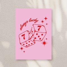 a pink card with two dices on it that says always lucky 7 / 7