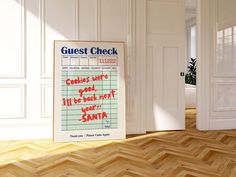 there is a sign that says guest check on the floor in front of an open door