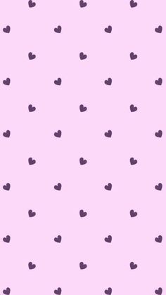 a pink background with black hearts on it