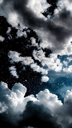 the sky is filled with clouds and stars