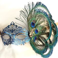 This filigree laser cut mask painted in Navy Blue and embellished with Rhinestones and adorned with Peacock feathers. If you pick the custom stone option, leave a note during check out with the colors you would like and a contact number to send pics for approval. Thank you for supporting small businesses and hope our products bring you and loved ones some joy and humor in these trying times. S H I P P I N G - Current processing times range 5-7 days. Pls note expedited & 1-2 day guaranteed de Masquerade Mask Women, Elegant Face Mask, Venetian Masquerade Masks, Feather Mask, Mask Painting, Venetian Masquerade, Blue Peacock, Mardi Gras Mask, Cool Masks