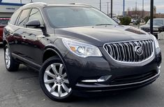 a black buick suv parked in a parking lot