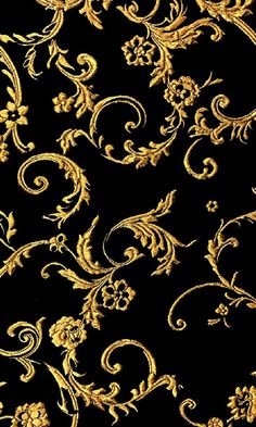 an ornate gold pattern on black fabric