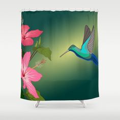 a shower curtain with a hummingbird and pink flowers on the outside, in front of a green background