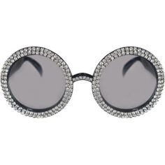 a pair of sunglasses with round frames and crystals