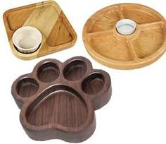 three wooden trays with paw prints on them, one is empty and the other has two