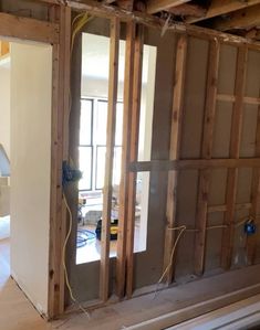 the interior of a house being remodeled with wood framing