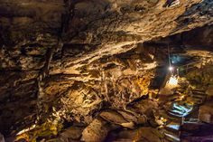 the inside of a cave filled with lots of rocks