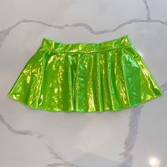 Perfect For Sumner Rave Season With This Pretty Shinny Green Mini Skirt One Size Stretchy Fabric Very Very Flattering Neon Green Mini Skirt, Neon Mini Skirts, Casual Green Skort For Party, Fitted Green Mini Skort, Trendy Fitted Green Skort, Fitted Green Tennis Skirt With Lining, Green Stretch Mini Tennis Skirt, Green Skirted Skort With Lined Skirt, Green Pleated Party Skort