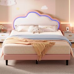 there is a bed with a pink headboard and blue trim