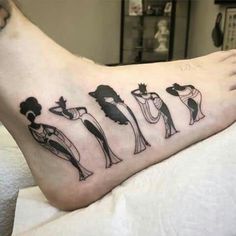 a woman's foot with different tattoos on it, including an image of women