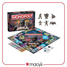 the monopoly godzilla board game is shown in front of it's contents