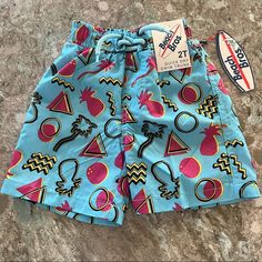 New With Tags! Beach Bros Toddler Swim Shorts/Trunks. Size 2t. 80/ Retro Print With Pineapples And Palm Trees. Very Saved By The Bell Vibes. Elastic Waist. Velcro Back Pocket With Shaka Logo. Ties At Waist Are Sewn Down So Can’t Be Removed. Mesh Liner On The Inside. From A Smoke-Free Home. Thanks For Looking! Check Out My Other Listings To Bundle! Playful Swim Trunks For Summer Activities, Playful Short Swim Trunks For Summer Activities, Playful Blue Swim Trunks For Summer Activities, Playful Blue Swim Trunks For Poolside, Blue Beachwear Bottoms For Summer Activities, Blue Bottoms For Beachwear In Summer, Playful Blue Swim Trunks For Summer, Playful Shorts For Beach Season Playwear, Playful Beach Season Shorts For Playwear