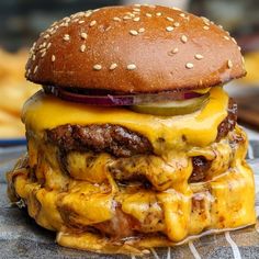 a hamburger with cheese and onions on it